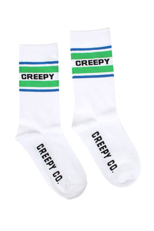 Pair of white athletic socks. The socks say Creepy across the top in black text surrounded by green and blue stripes. The bottom of the socks say Creepy Co. in black text. White background.