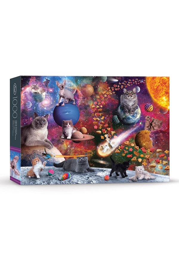 1000 piece puzzle of outer space featuring galaxies, planets, and stars. There are also cats scattered about along with cat toys and cat food kibble acting like a planet ring.