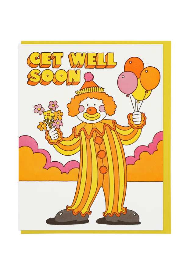 Greeting card of a clown in a striped outfit holding balloons and flowers. The card says Get Well Soon. Yellow envelope. White background.
