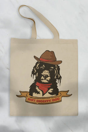 Natural cotton tote featuring a black and white dog wearing a cowboy hat. Below the dog in a yellow banner the tote says Hot Diggity Dog in red western style text. White background.