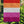 Load image into Gallery viewer, Lesbian Pride flag hanging on a garden flag pole. The flag consists of 5 horizontal stripes of Red, orange, white, pink , and dark pink.
