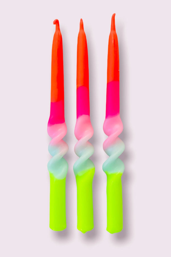 Three pack of slim tapered, hand dyed, and twisted candles in orange, pink, blue, and lime green gradient.