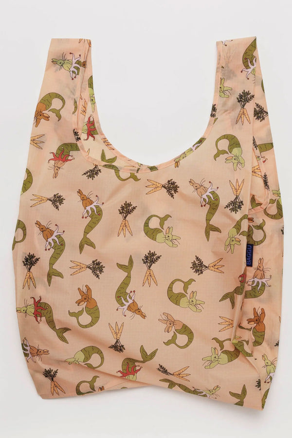 Light pink reusable tote featuring illustrations of Mermaid Bunnies and Carrot bundles printed all over it.