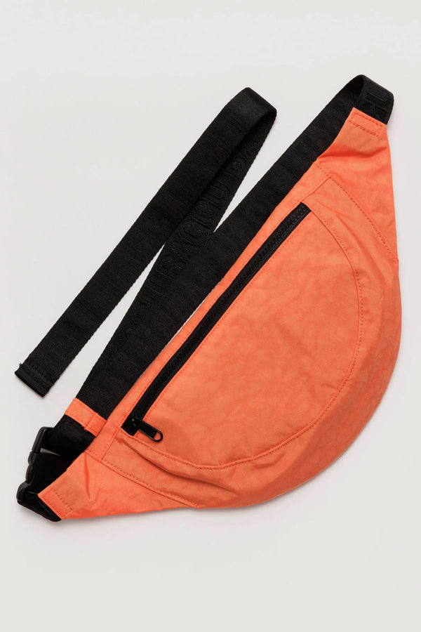 Nylon crescent shaped fanny pack in orange. Black straps.