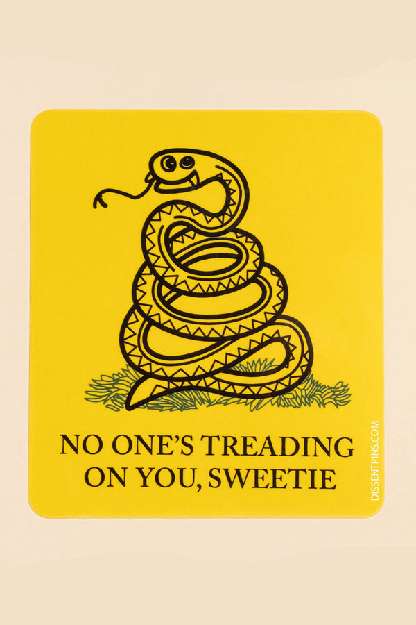 Vinyl sticker of a parody design of a snake on a yellow background. Under the coiled snake the sticker says, No One's Treading on you , Sweetie.