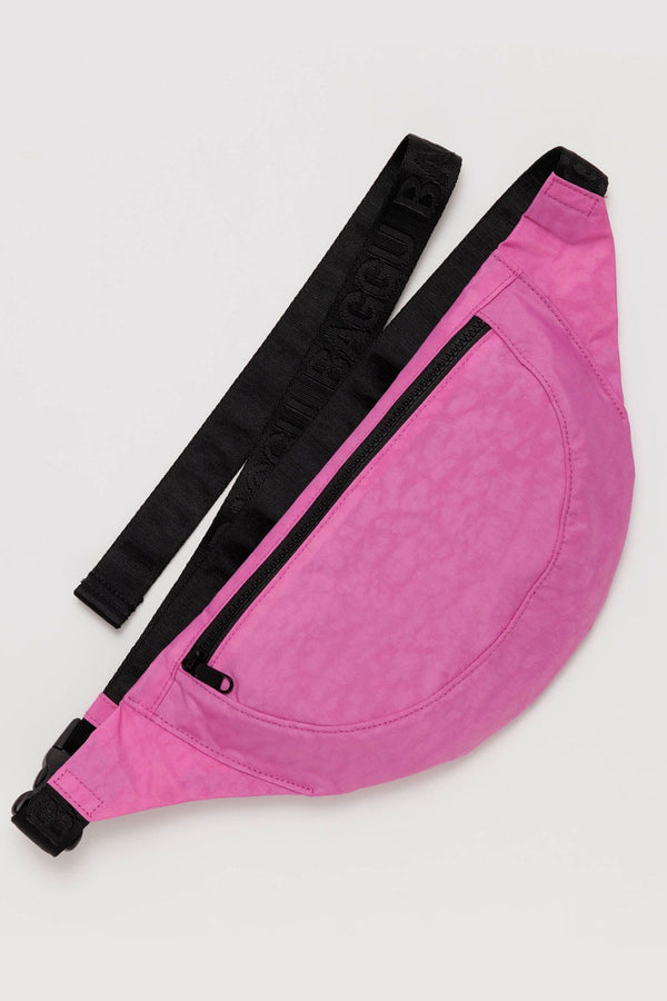Nylon fanny pack in pink with black straps.