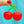 Load image into Gallery viewer, A person holding a small silicone container shaped like cherries on a green stem.
