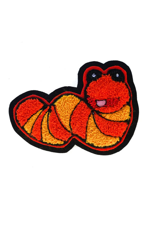 Slimey, a small worm character from Sesame street. Orange and yellow chenille patch with a black border. White background.