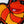 Load image into Gallery viewer, Close up photo of Slimey, a worm character from Sesame Street. The patch is orange and yellow with a pink tongue and black and white eyes. Black border. White background.
