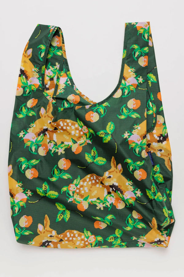 Large shopping bag in Forest green featuring needlepoint style illustration of baby deer surrounded by fruit and greenery printed all over. White background.