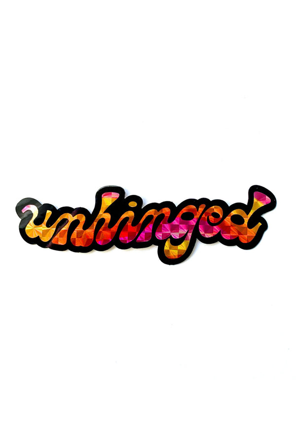 Die cut holographic sticker that says Unhinged in pink yellow orange with a black border.
