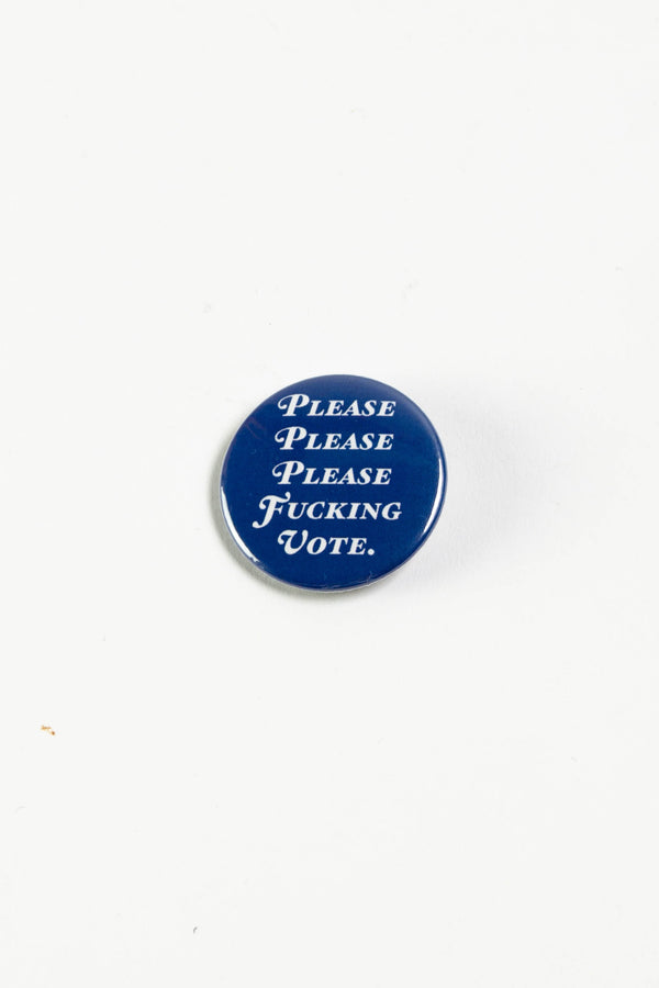 A royal blue pinback button on a white surface. The white text on the button reads "Please please please fucking vote."
