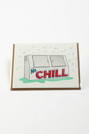 White Card with kraft brown envelope on white background. The card depicts a gas station ice chest that says No Chill on the side with snow flakes around it. 