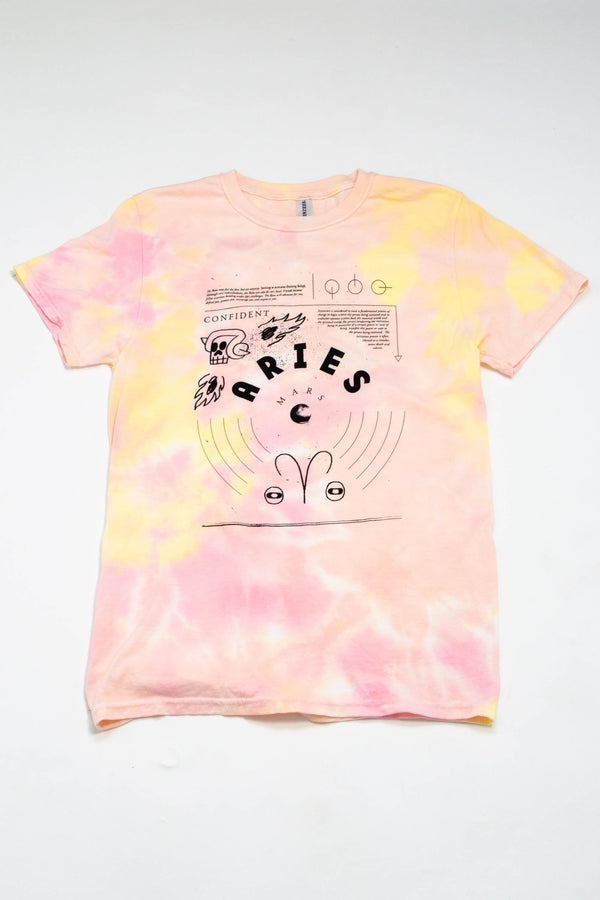 A pink and yellow tie-dyed tee shirt with depictions of the astrological symbols for Aries. 
