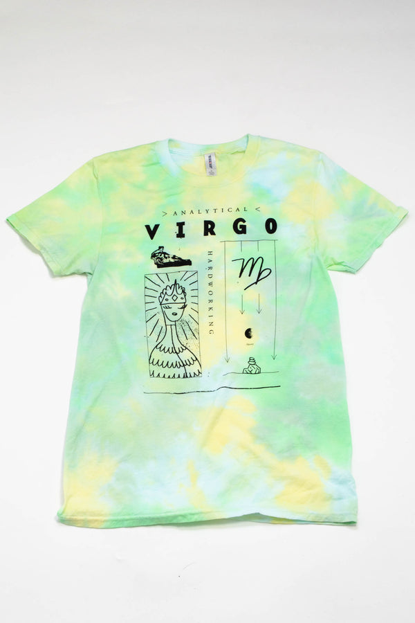 A lime green, yellow, and light blue tie-dye tshirt laying on a white background. The shirt has illustrated symbols regarding the zodiac sign of Virgo. Interspersed between the illustrations are the words "analytical", "hardworking", and "Virgo.""