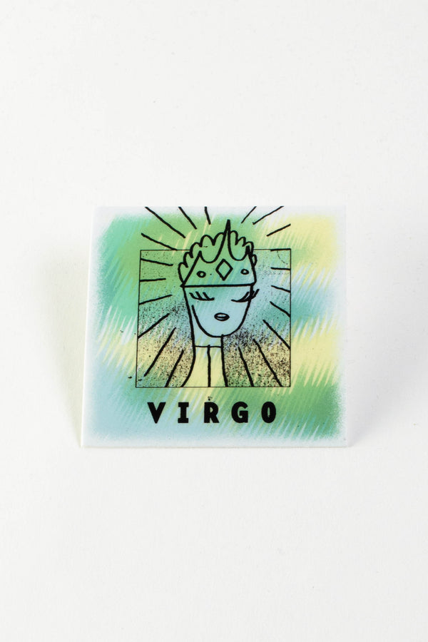 A square sticker with varying colors of light blue, light green, and yellow. The sticker says "Virgo" in black text and has an illustration of a person with long eyelashes wearing a crown.