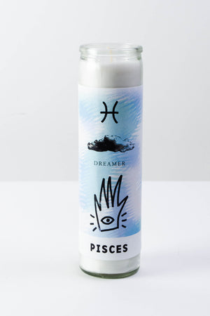 A tall clear glass votive candle sitting on a flat white surface. The green, white, and purple decal has the zodiac symbol for Pisces, a cloud, the word "dreamer" and an abstract hand with an eyeball. The black text at the bottom reads "Pisces."