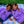 Load image into Gallery viewer, Two women wearing purple &quot;Healing is Hard&quot; t-shirts are laying on a blue checkered picnic blanket in the grass. Flowers are in their hair and some flower petals are scattered on the blanket.
