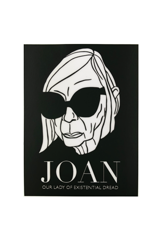Black rectangle sticker with a black and white portrait of Joan Didion's face wearing sunglasses. The sticker says Joan Our Lady of Existential Dread in white text. 