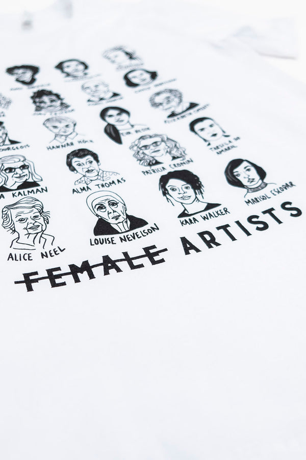 An up-close view of the bottom portion of the white tee shirt depicting female artists.