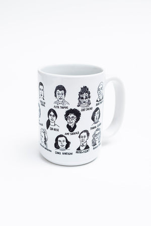 A white mug with illustrations of many historically significant female artists. 