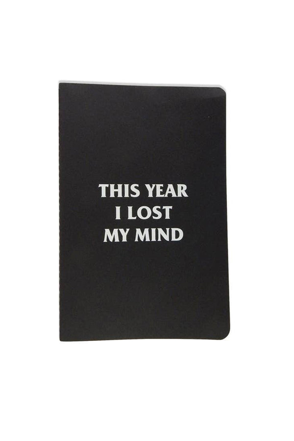 Black journal on a white background. The Journal says "This Year I Lost My Mind" in white text.