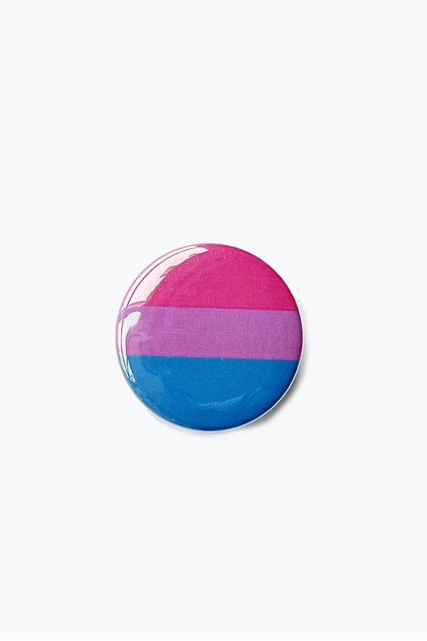 A pinback button with the pink, purple, and blue striped colors of the bisexual pride flag. Button is on a white background.