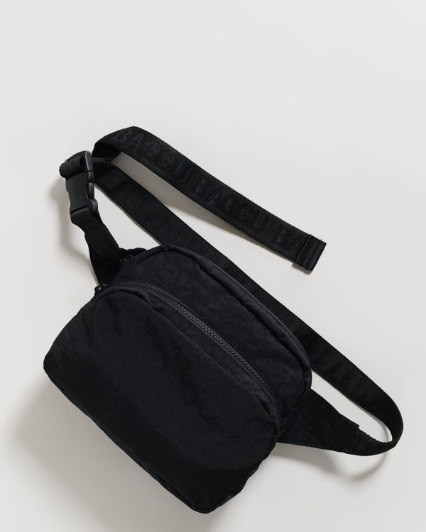 A black fanny pack with black straps on a white background.