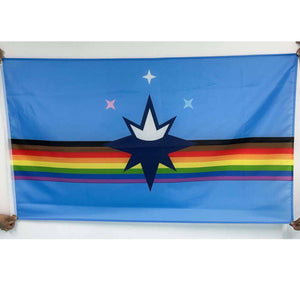 Two people holding pride version of the Springfield City flag. Springfield City Flag features a rainbow stripe with brown and black stripes added to it. On top of the stripes is one big star with a crown and three small stars above that. White background.