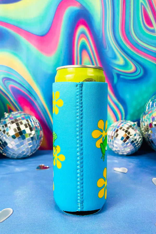 Side view of tall bright blue koozie with yellow retro flowers printed all over it with a bright green frog in the middle. Rainbow swirls with disco balls in the background.