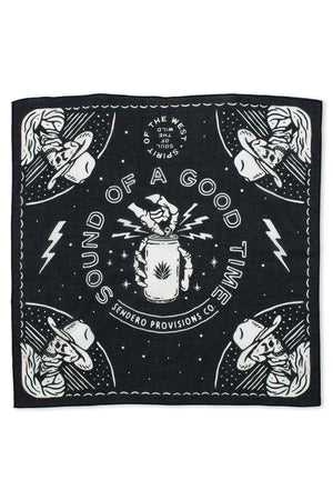 Black bandana featuring a skeleton cowboy under a starry sky in each four corners. in the middle a skeleton hand is opening a can of beer, with the words "Sound of a good time" around it. 