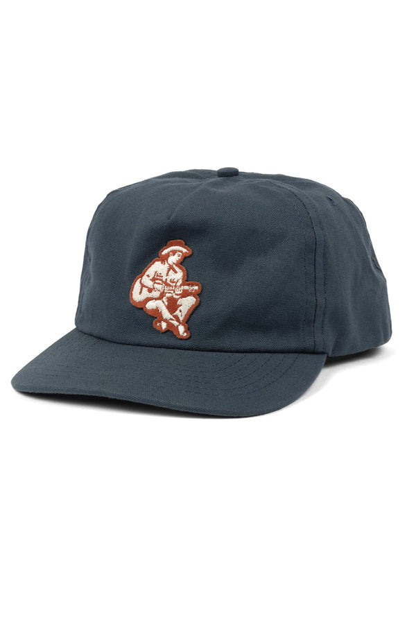 Navy baseball cap on a white background. The hat features a red and white illustrated patch of Hank Williams playing a guitar.