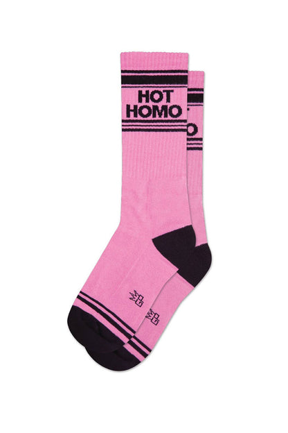 A pair of pink socks with black vertical stripes and black text that reads "Hot homo"