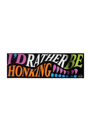 A black bumper sticker with colorful text that reads "I'd rather be honking!!!!!!!"
