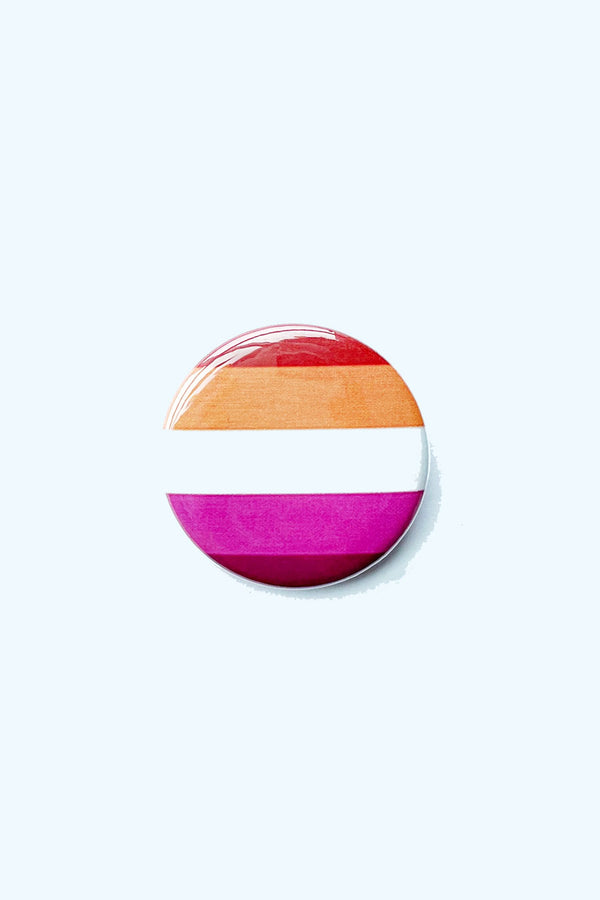 A red, orange, white, pink, and maroon striped pinback button. These colors represent the lesbian pride flag.