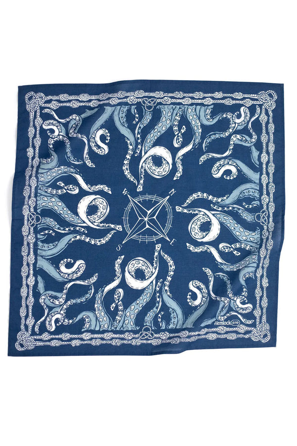Navy blue bandana featuring a nautical design of octopus tentacles surrounding a compass in the middle with a knotted rope illustration around the border. White background.