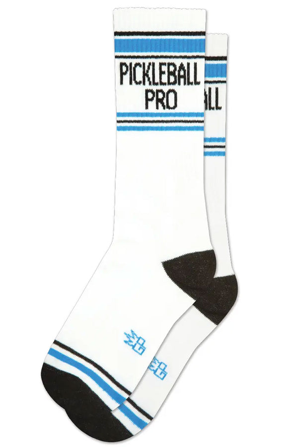 White mid-calf socks with a black heel and toe. Across the toe is a blue stripe with a thin black stripe above it. Across the top of the socks are black and blue stripes and in between them the socks say Pickleball Pro in black lettering. White background.