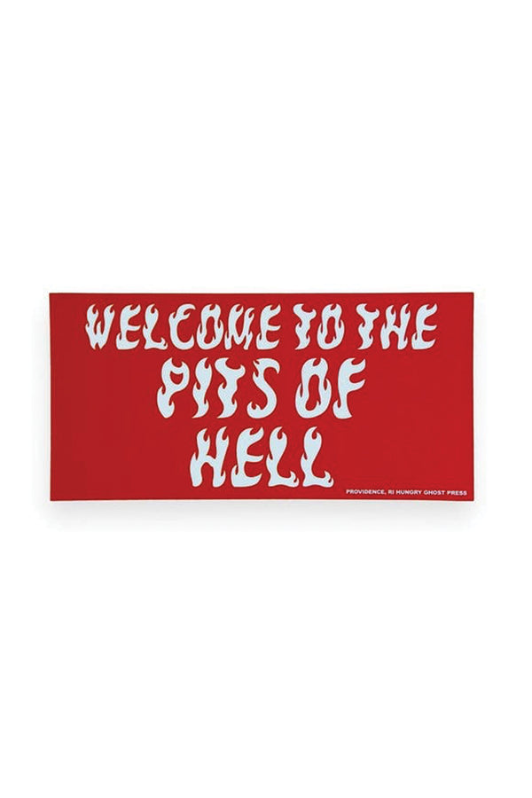 A red rectangular bumper sticker with white flaming text that reads "Welcome to the pits of hell."