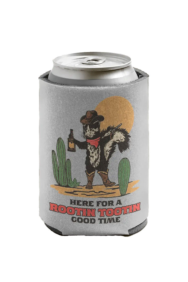A light gray can koozie sits on a white background. There is an illustration of a skunk dressed as a cowboy holding a beverage and a pistol, standing in the desert. The text reads "here for a rootin tootin good time."