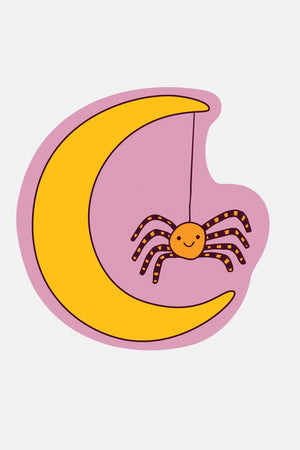 Vinyl sticker of a yellow crescent moon with a spider dangling from the top of it. White background.