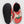 Load image into Gallery viewer, One pair of puffy black fleece lined slippers on a white backdrop. One slipper is turned over showing the black rubber sole that has embossed circle pattern and says BAGGU. The Slippers have a backless heel and are light pink with large strawberries printed on them.
