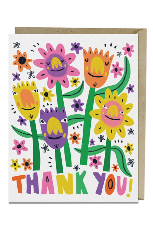 White card with kraft brown envelope on a white background. The card features 5 Flowers with smiling faces and expressions in Pink, purple, orange, and yellow colors. Below the flowers in multicolor letters the cards says Thank you!