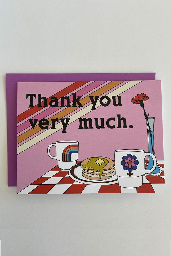 Pink Card with purple envelope on white backdrop.  The card says Thank you very much above a breakfast setting on a red and white checkered table cloth. On the table is a couple of coffee mugs, a stack of pancakes, and a carnation in a vase. 
