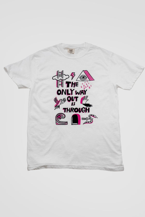 White tshirt on a white background. The tshirt says "The Only Way Out is Through" in pink and black block letters. Surrounding the text are black and pink illustrations of a ladder going through a cloud, a triangle with a crying eye in the middle, a flying bird, a hand and its shadow, a wave, a snake with a knife piercing it, and a dark arched passageway.